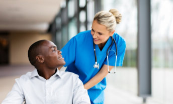 nurse helping the young man with wheelchair