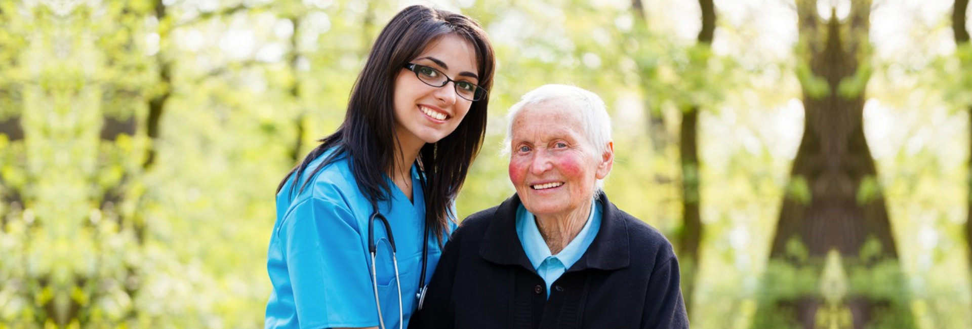nurse and senior woman are smiling