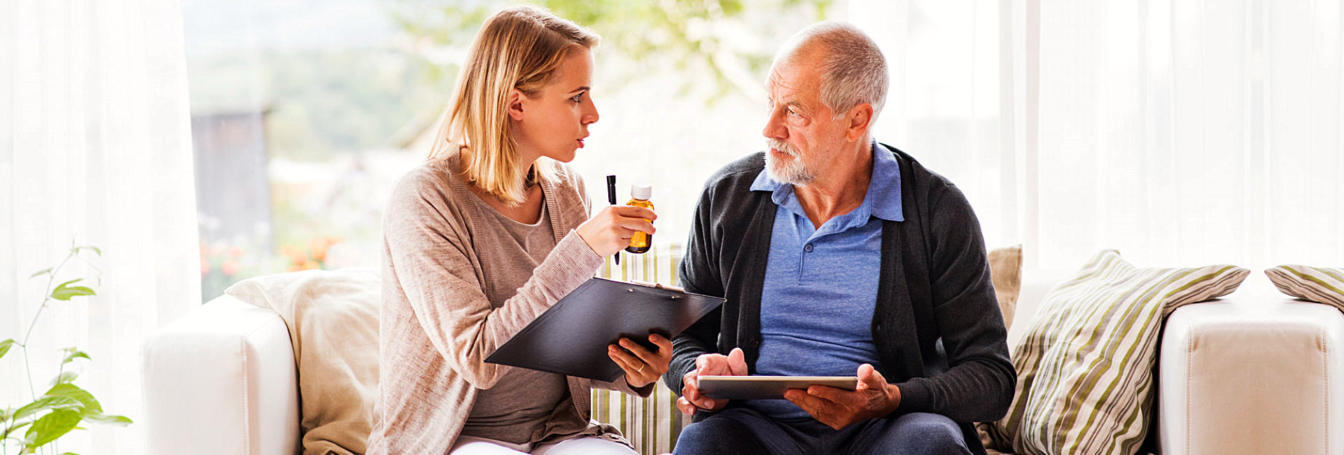caregiver and senior man having a conversation