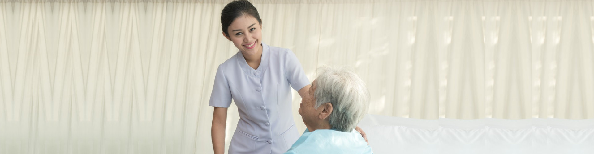 caregiver assisting senior man