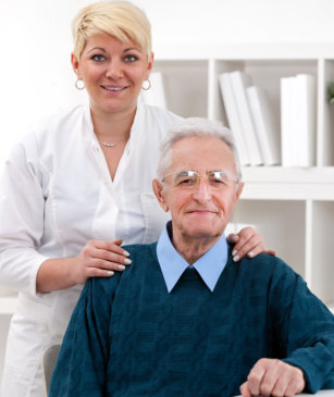 Senior patient with nurse at clinic